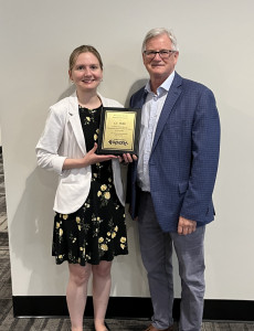 Annual Giving Manager Liz Millar five-year service plaque from General Director & CEO, Larry Desrochers.