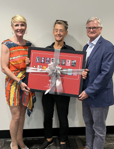 Dr. Bill Pope receives commemorative framed poster from Board of Trustees Chair, Judith Chambers and General Director & CEO, Larry Desrochers.