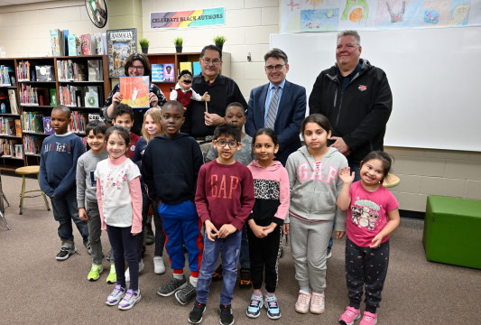 L to R (back row): Keely McPeek, John McLean, Brian Mayes, and Chris Sigurdson, School Trustee, Louis Riel School Division Ward 2, with students in the Ojibwe Language Program at Victor Wyatt School. Photo: R. Tinker