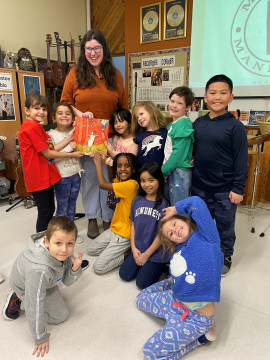 Keely McPeek with grades 1 and 2 students from Victory School. Photo: Lisa Rumak